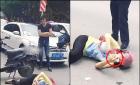 女子遭遇车祸 躺在马路中间玩手机(图)
