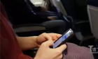 国内：注意！以后坐飞机玩手机可能被罚5万(图)